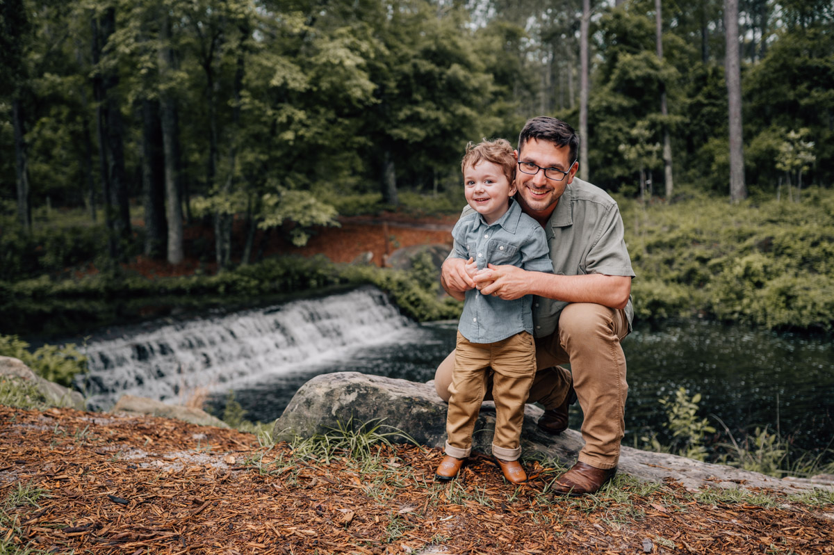 Dad and son smiling during family session with Oh mama photography, Lexington SC Family Photographer