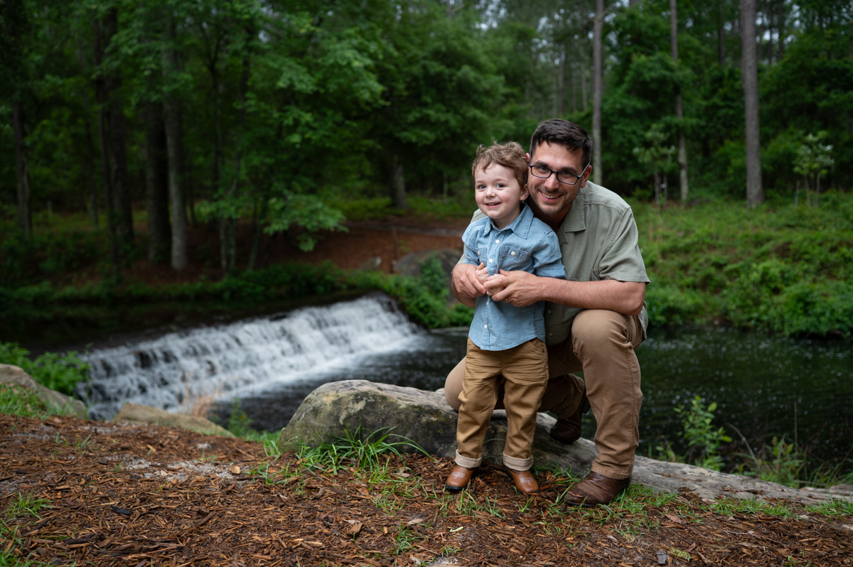 Dad and son smiling during family session with Oh mama photography, Lexington SC Family Photographer