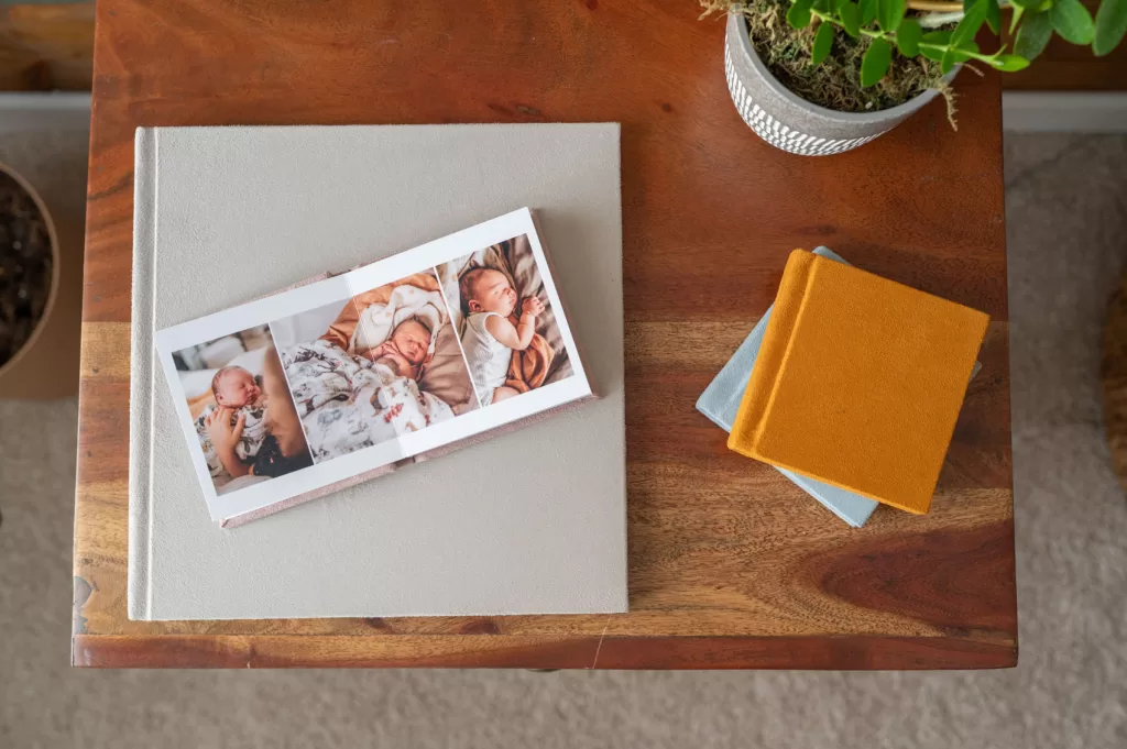 Family session images displayed in a heirloom photo album in your home